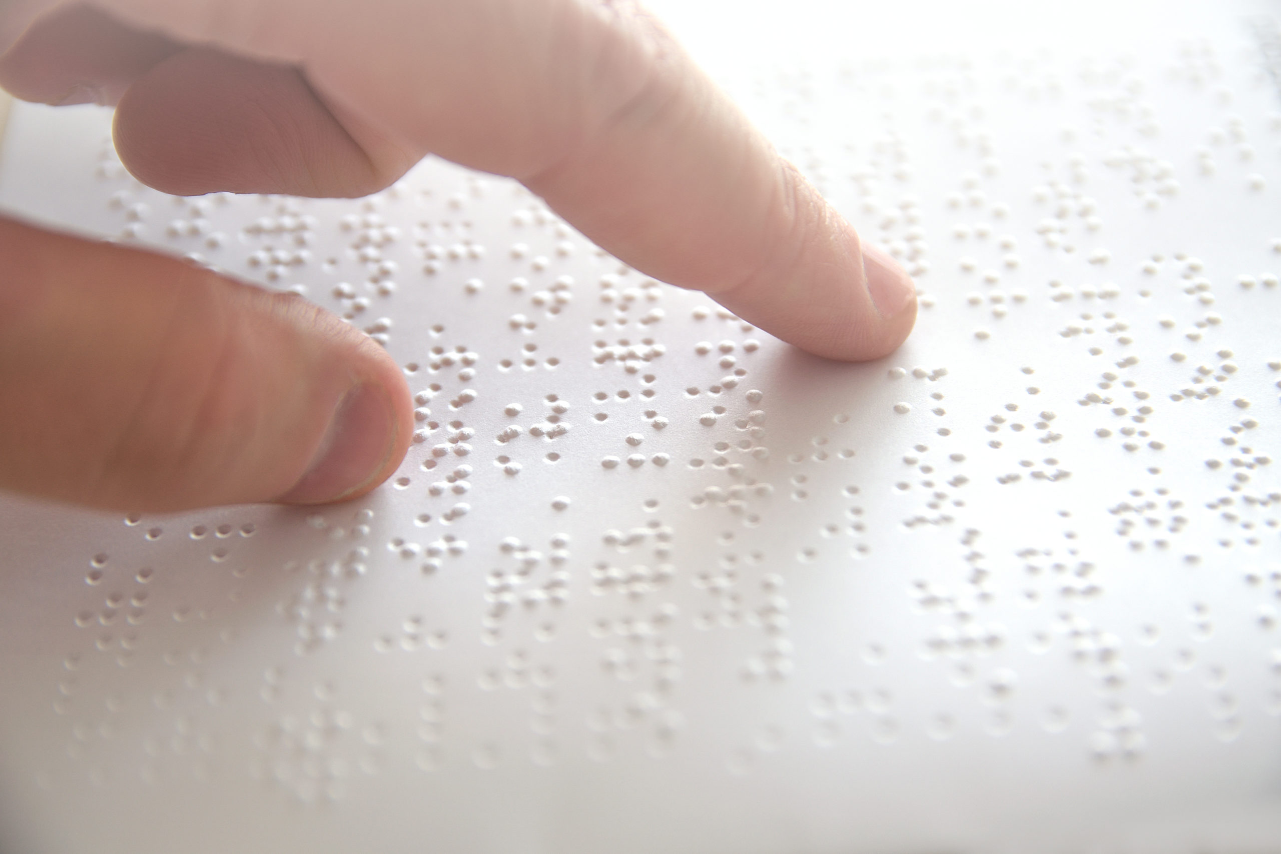 person reading braille text