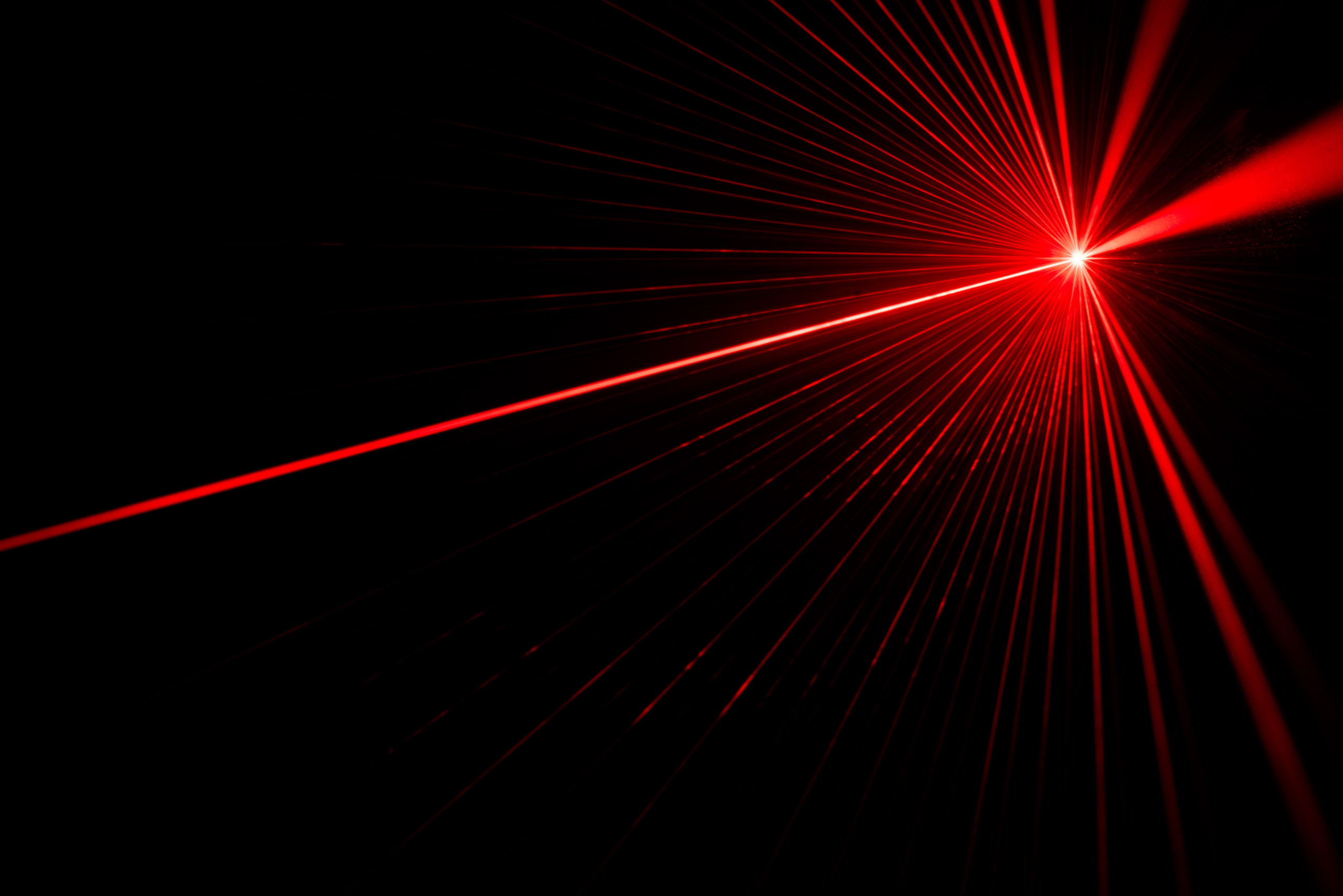 red laser on a black background