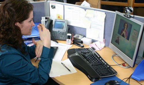woman using assistive tech at work to attend a meeting on the computer