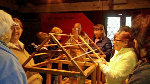 a group of people doing an activity at the strawbery banke museum