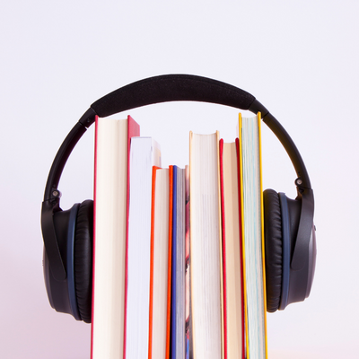 books with headphones around them