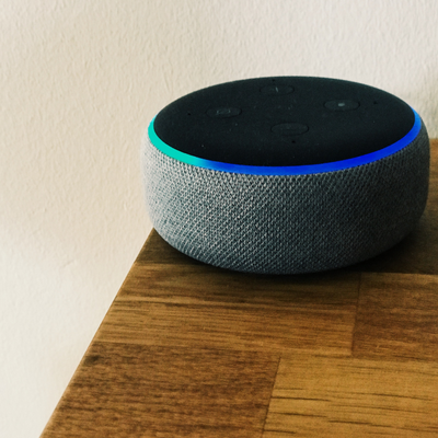 An Amazon Alexa on the edge of a table