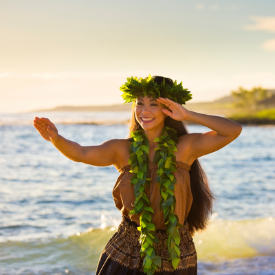 girl hula dancing by the beach