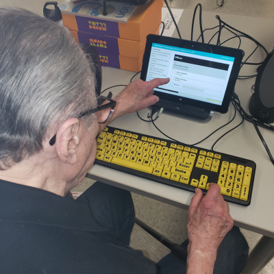 a man uses the accessible voting system