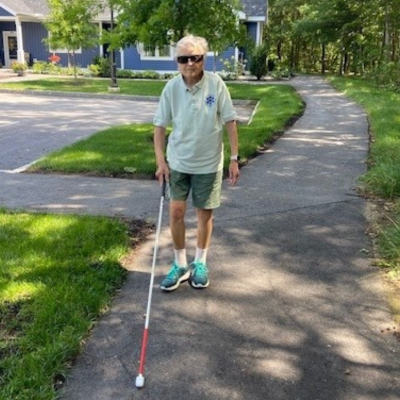 Woman with white cane