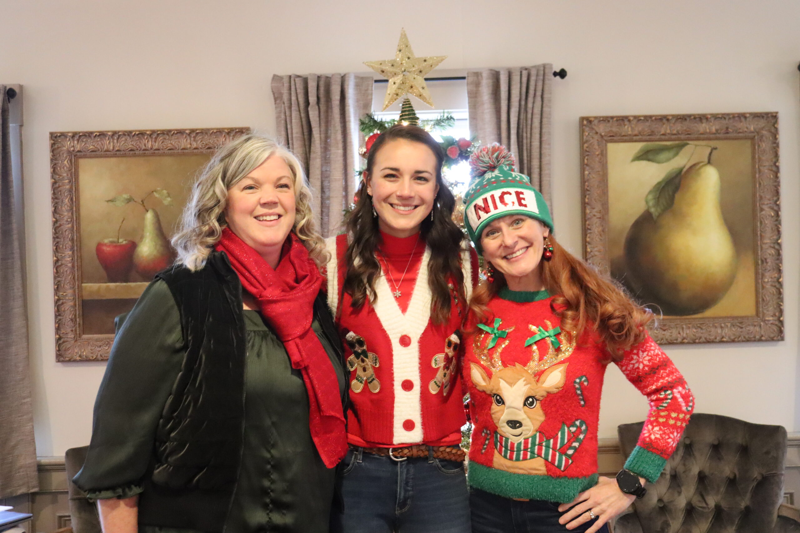 Hannah, Jillian and Beth in with the Christmas tree.