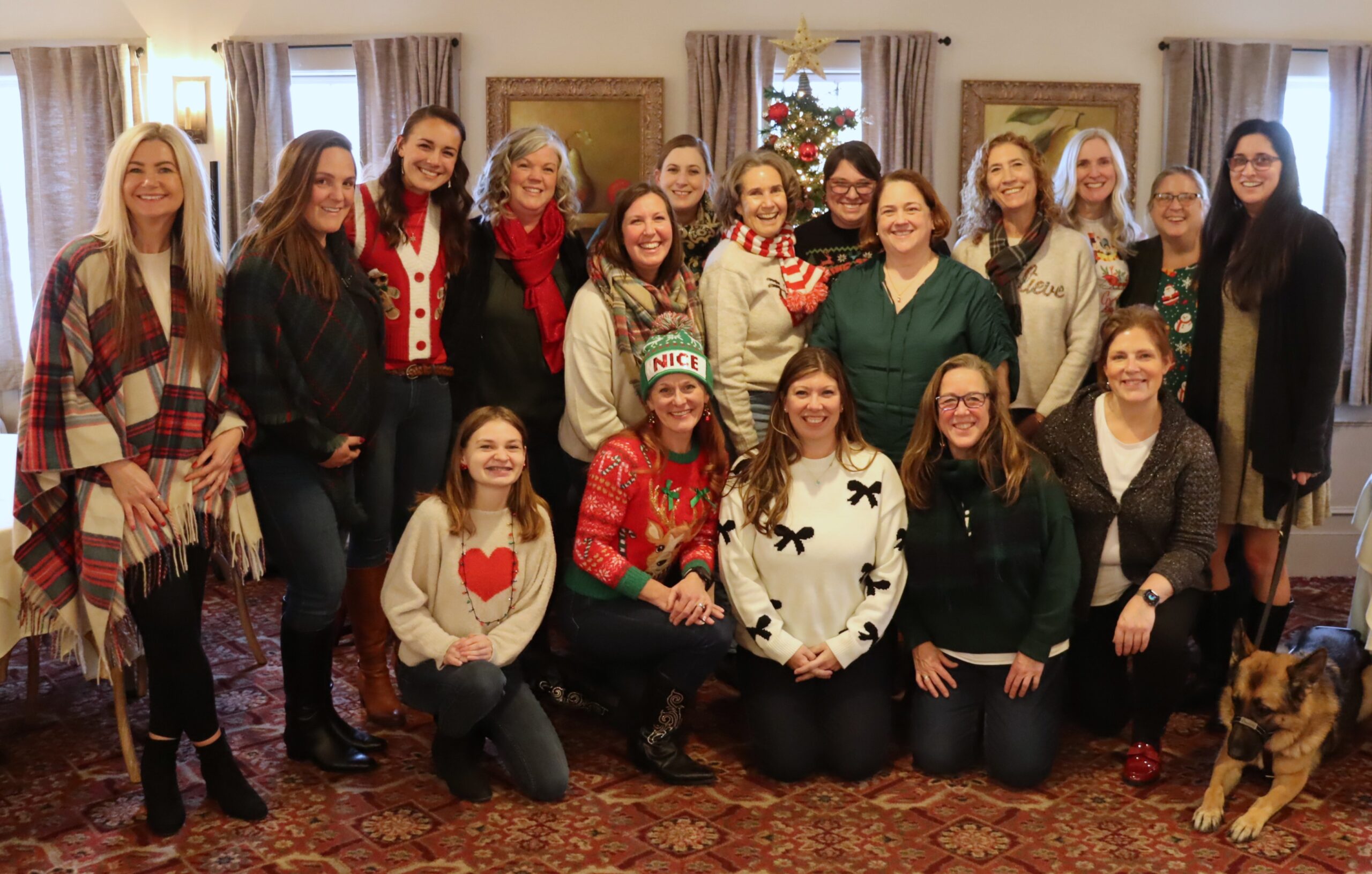 The Future In Sight staff in front of the Christmas tree.