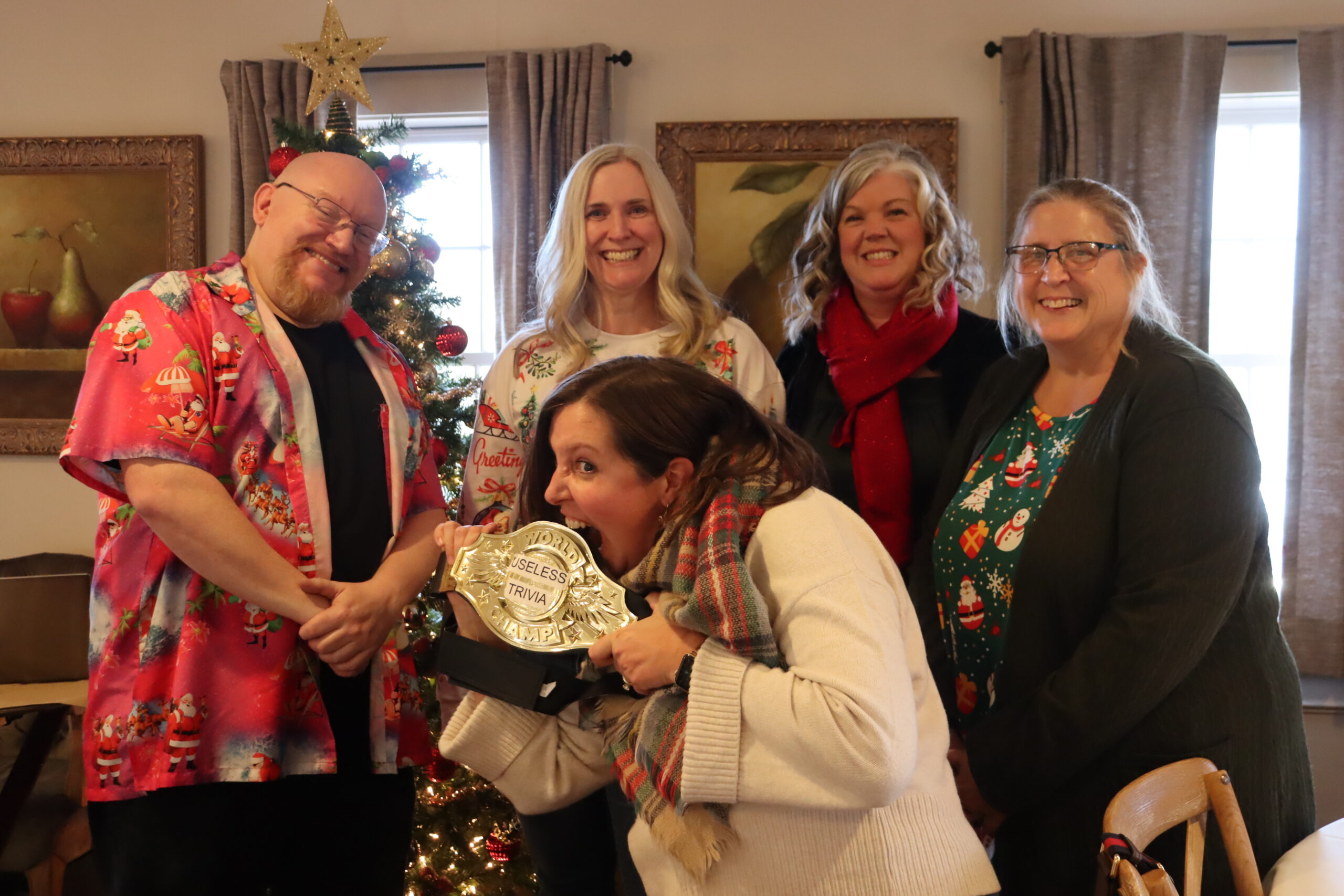 DJ Daryl, Michelle, Hannah, Lindsay, and Janis posing with the winning prize belt.