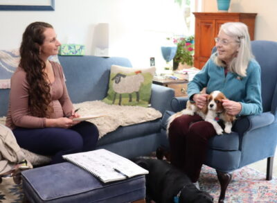 A senior woman talking with an occupational therapist.