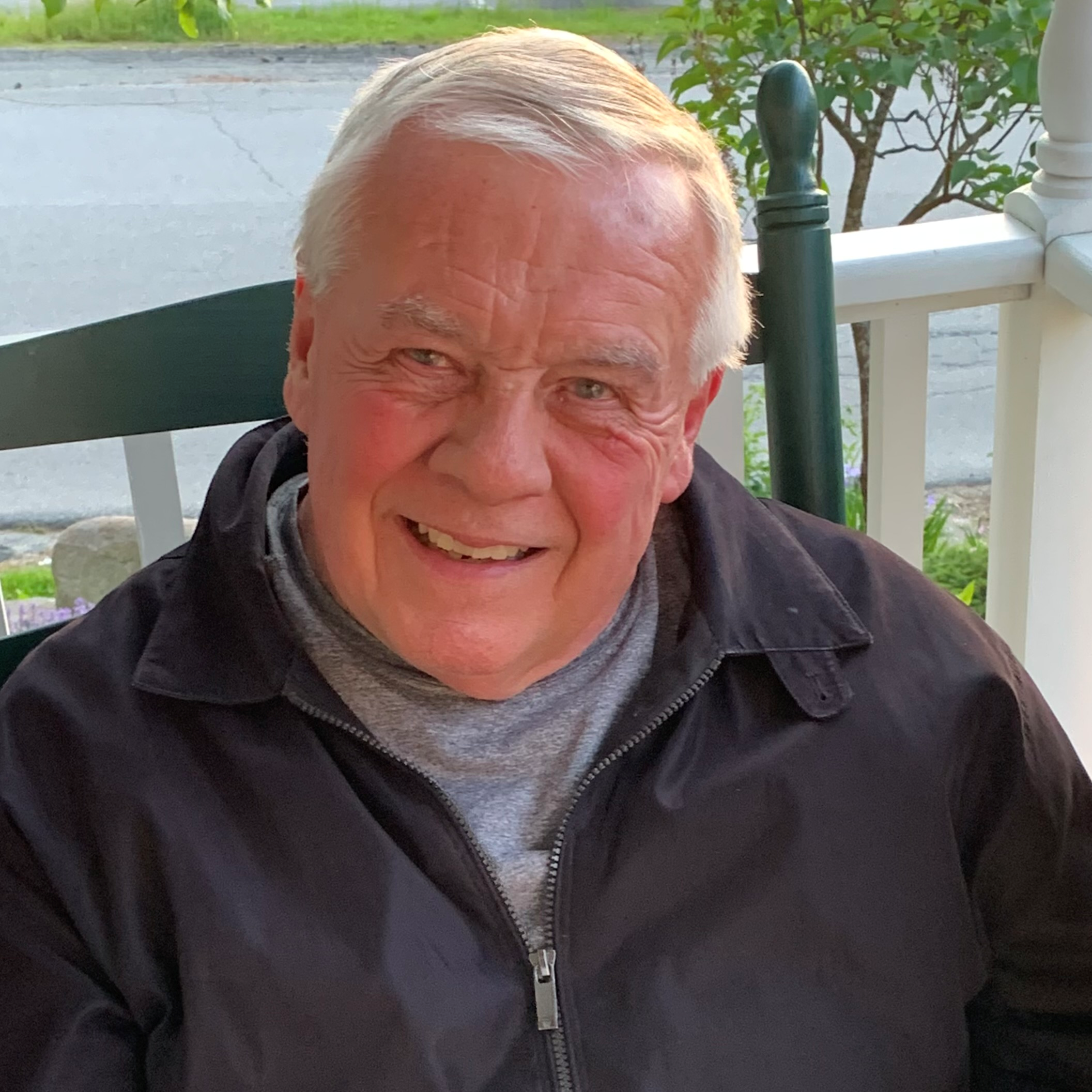 Dave Kenepp sitting outside and smiling.