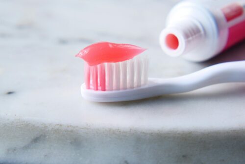 A toothbrush and toothpaste.