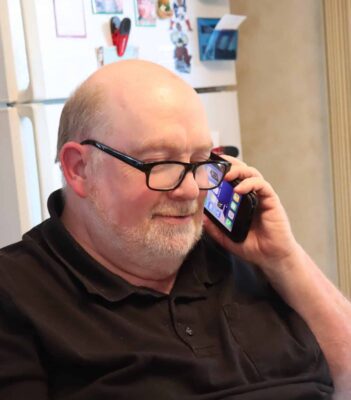A senior speaking on a TEAP iPhone.